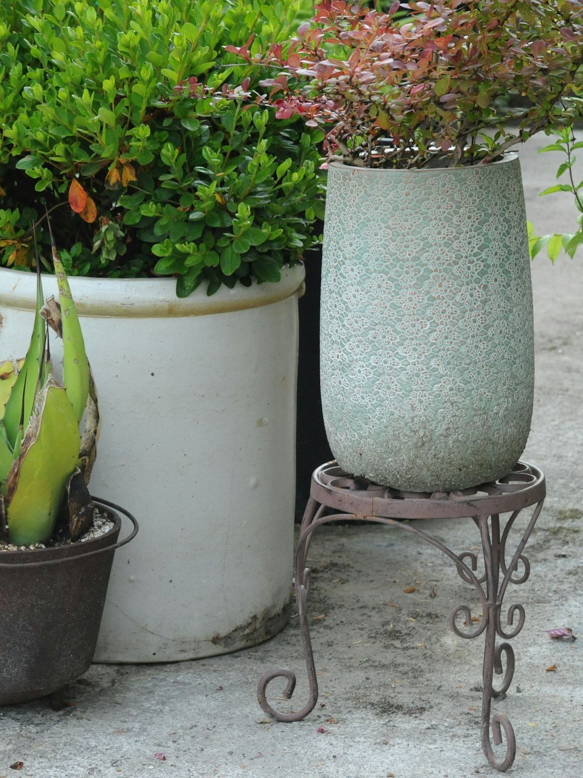 A crew member at work on a patio planter