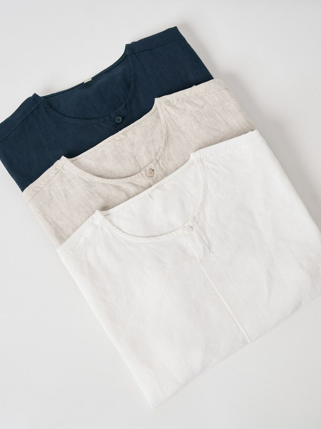A folded navy long-sleeve tee