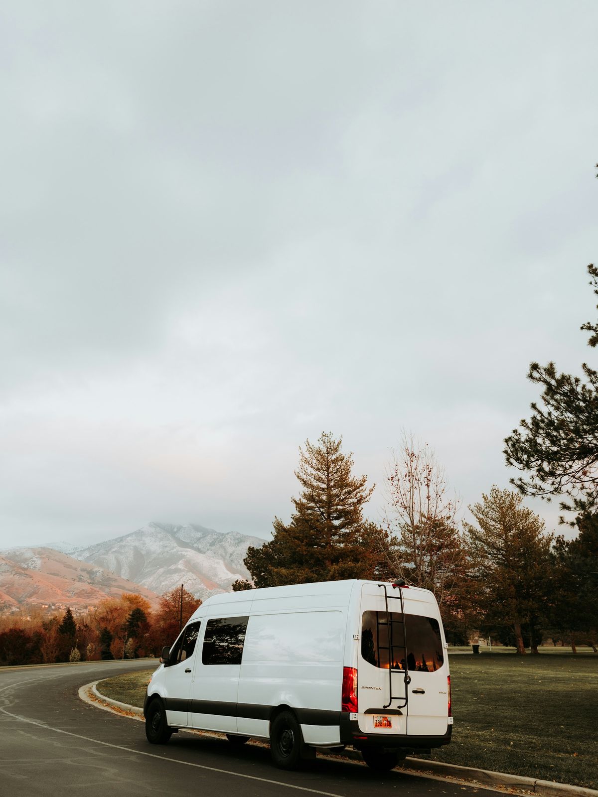 A work van and crew member on a job