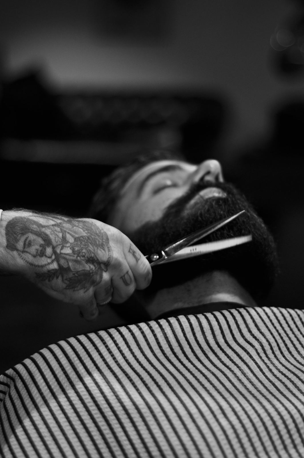 A beard trim in black and white