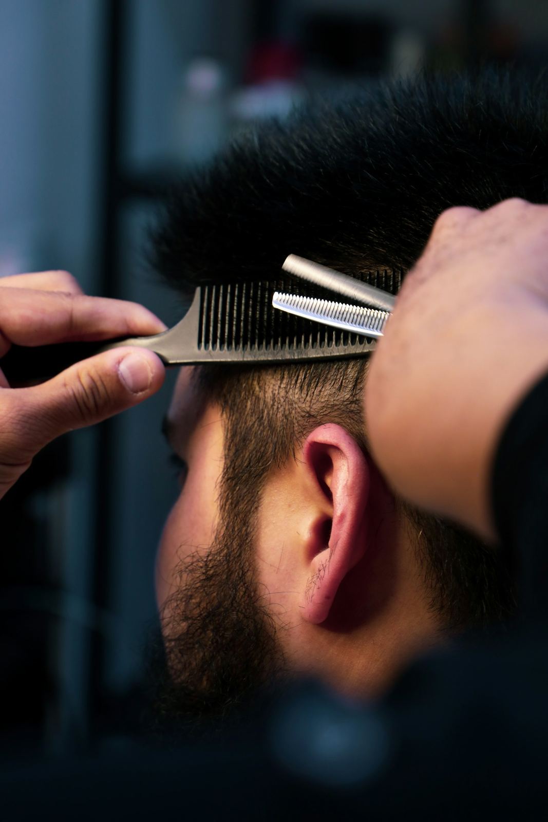 Thinning shears over a comb