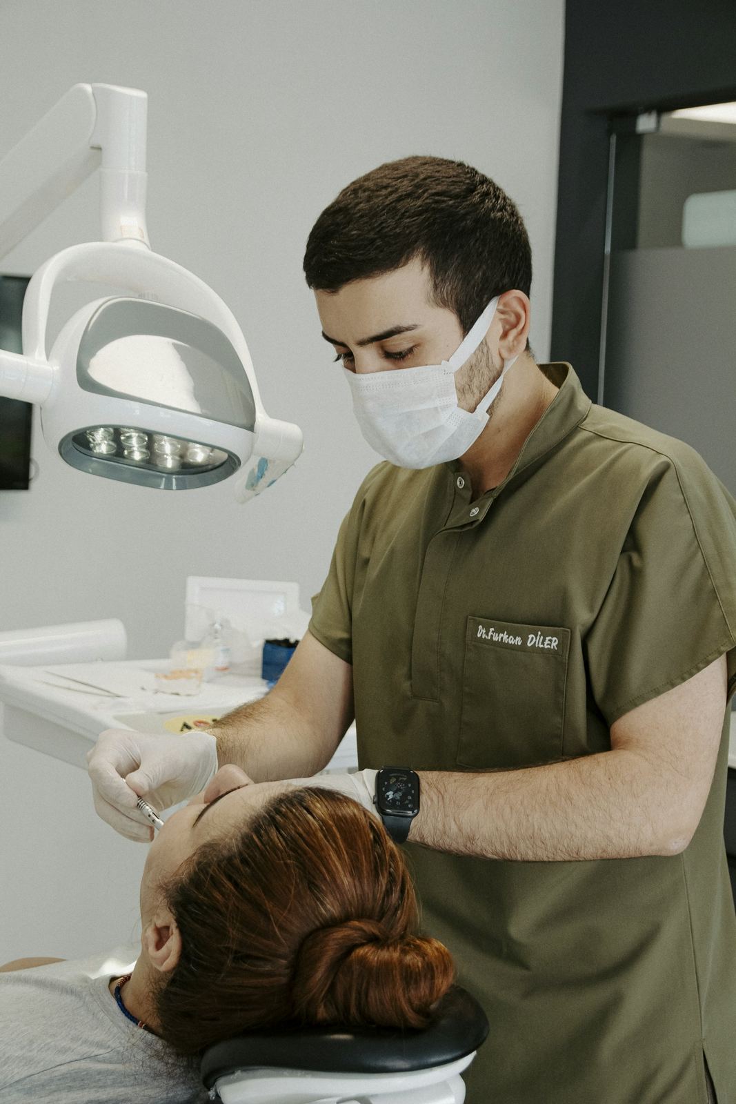 A dentist examining a patient