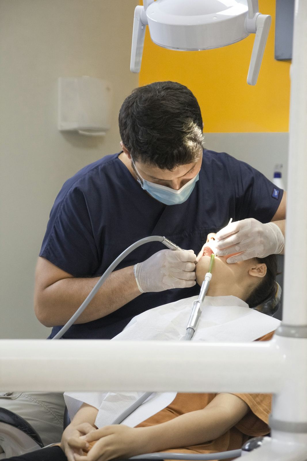 A dentist examining a patient