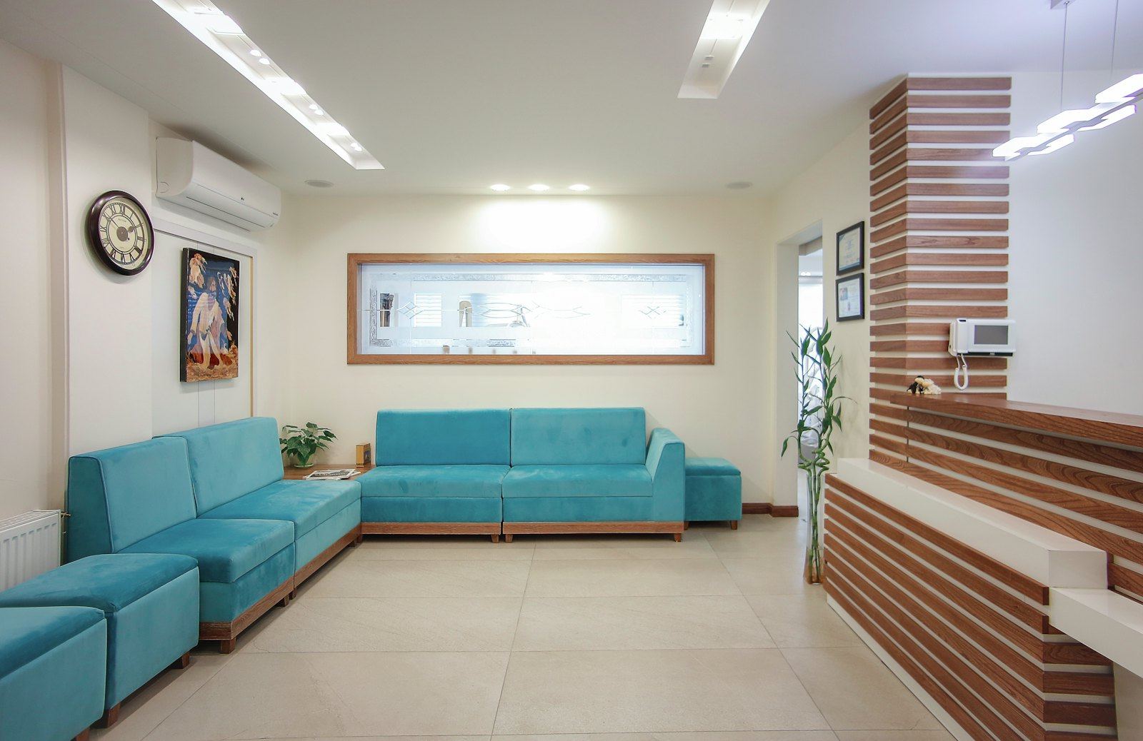 A calm waiting room with a long sofa