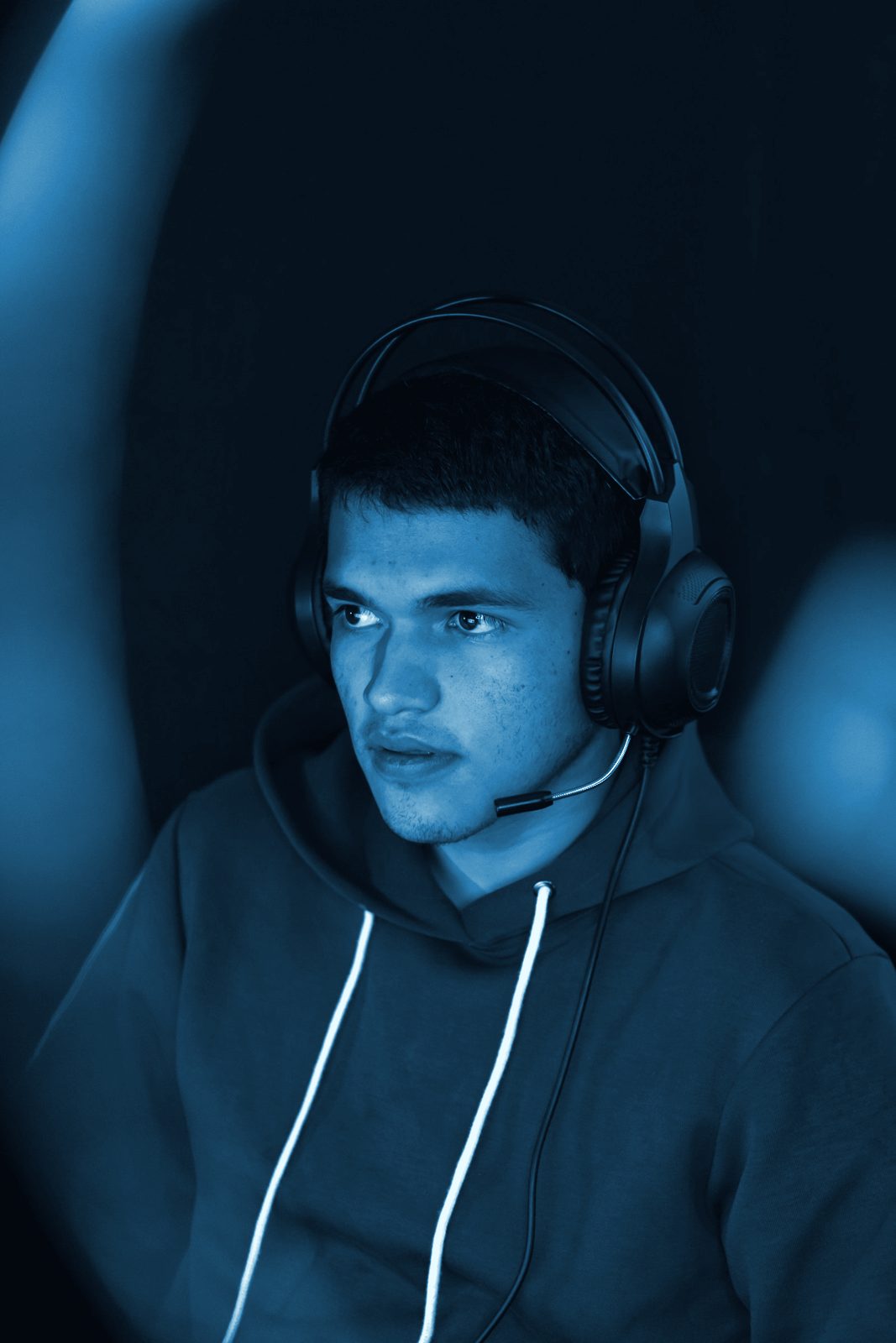 A player in a headset, toned blue
