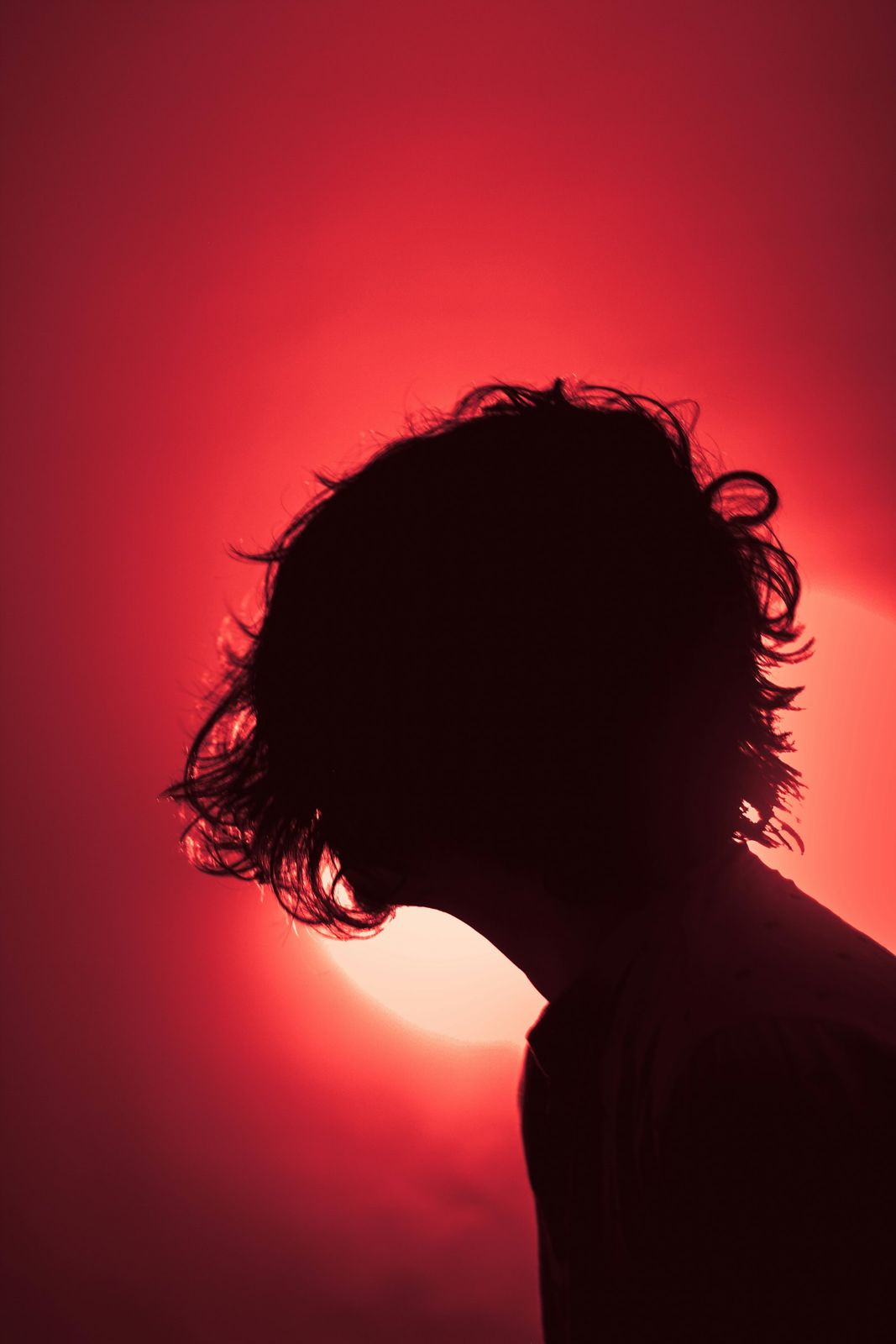 A silhouette against red light