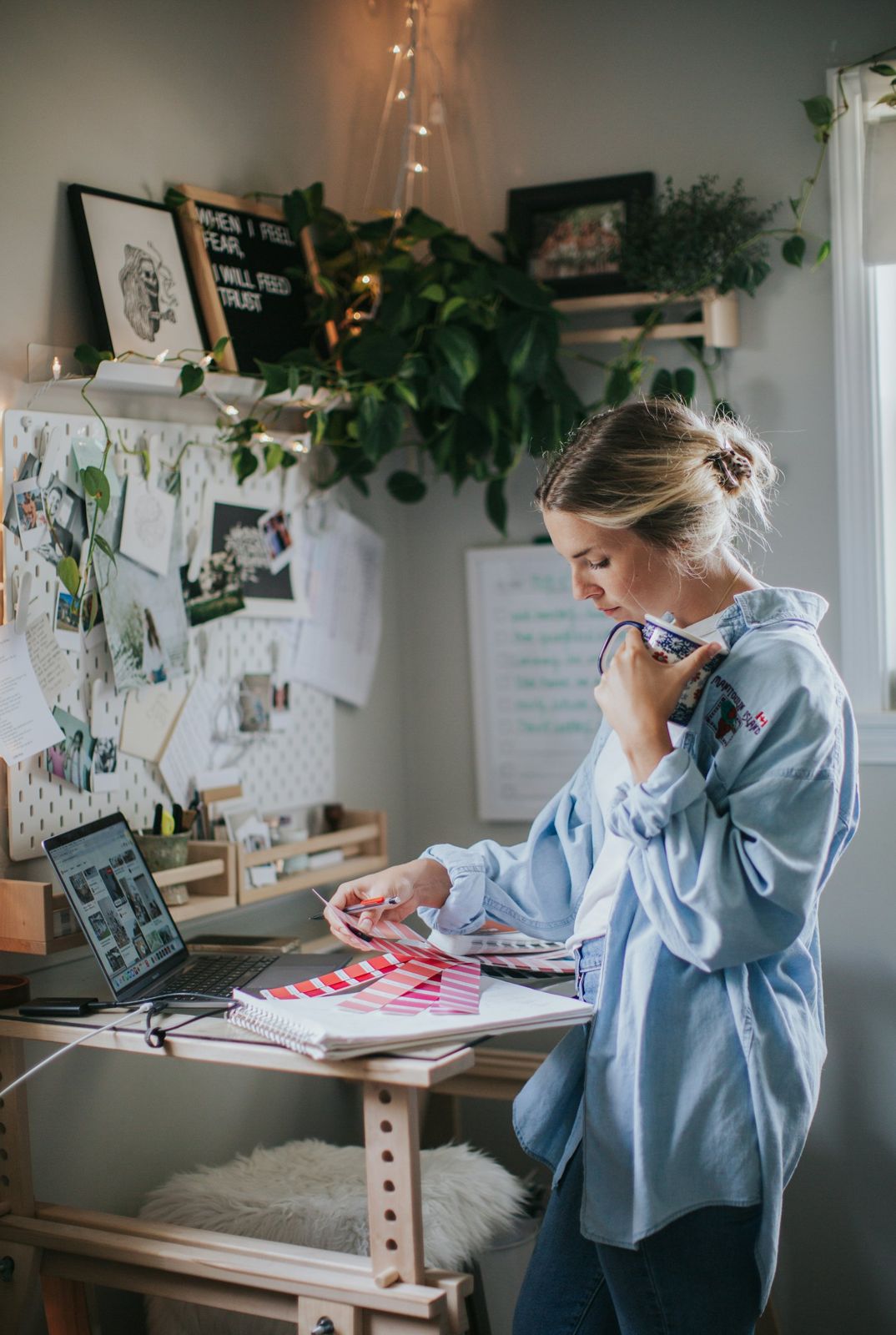 A designer at a desk in a home studio