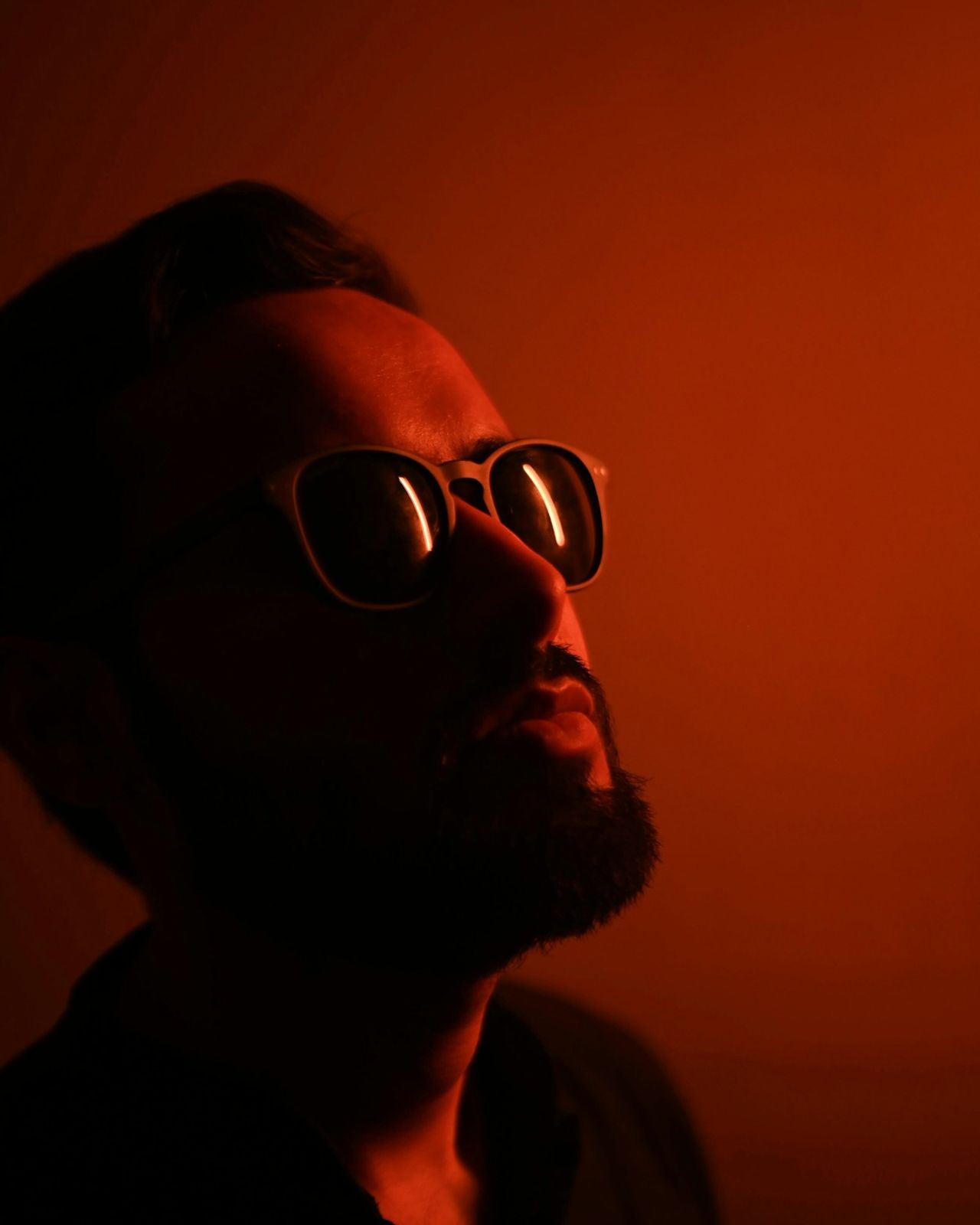 This week's guest DJ, in sunglasses, lit red