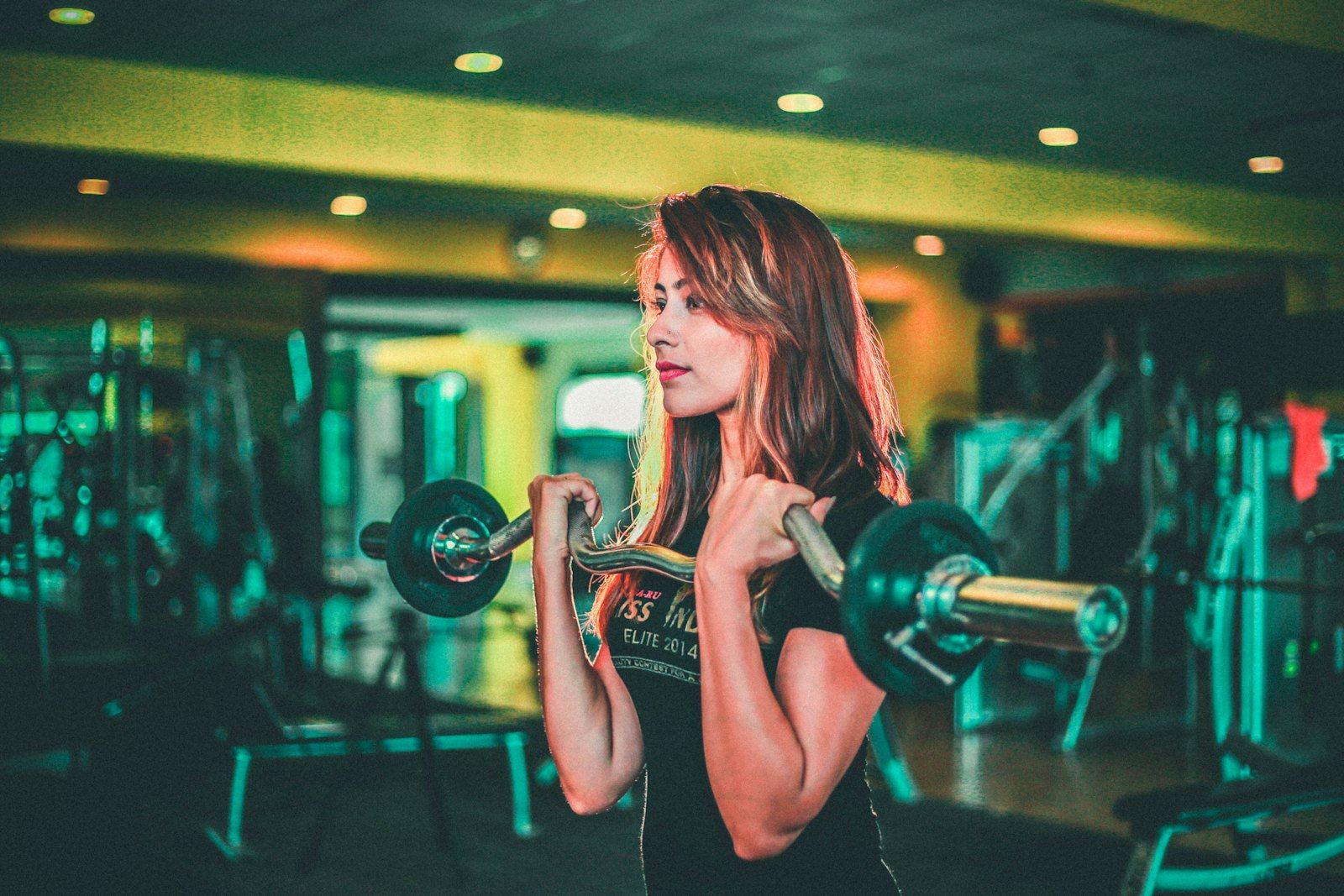 A woman doing barbell curls
