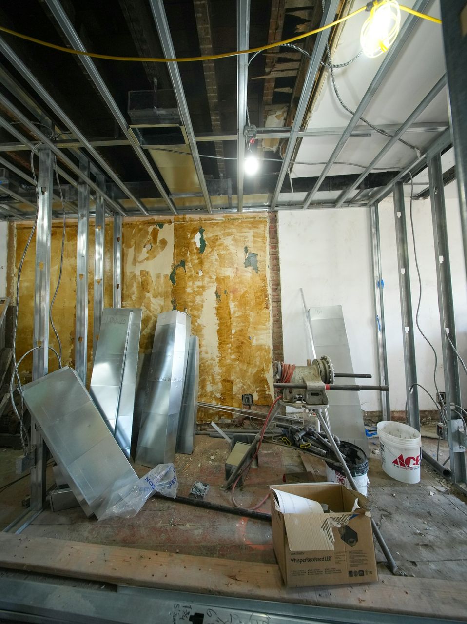 A gutted commercial floor with mini containers